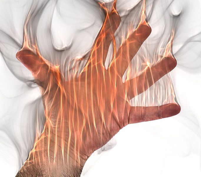 Human hand on fire with orange flames van MPfoto71