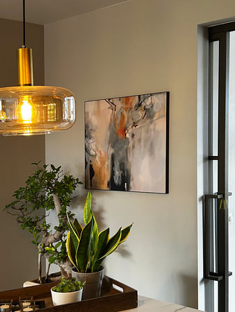 Modern abstract painting in white, black, orange, blue and green