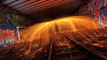 Lightpainting with steel wool in a graffiti tunnel