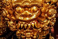 statue gods face hindu gold on bali indonesia