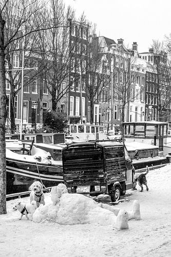 Snowman and dogs on the canal