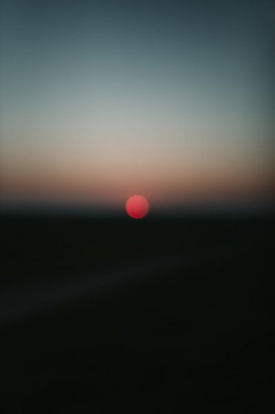 Abstract sunrise with red sun by Ayla Maagdenberg