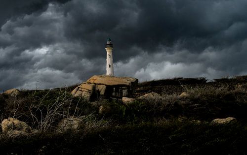 Thunderclouds around the lighthouse of Aruba by Ronald Huijben