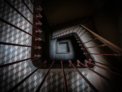 Staircase in a castle, photographed downwards. Dark and mysterious. History, mysterious.