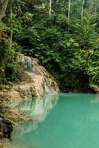 Waterfall with green lake in the rainforest Mudal