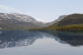 Serene Mountain Reflection over Crystal Clear Lake by Gottfried Carls