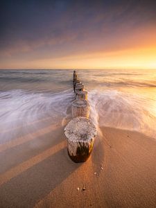 Breakwater posts during sunset