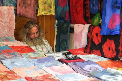 Mister in fabric market stall