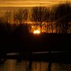 Coucher de soleil sur l'eau sur Fleur Gaastra