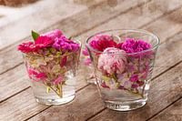 Beautiful, fresh mixed flowers arranged in textured glass vases.