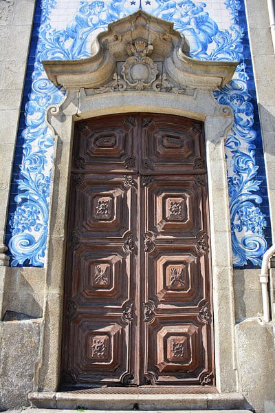Wooden door and blue tiles in Porto Portugal by My Footprints