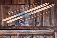 Old skis at a wooden hut in Switzerland