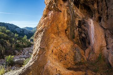 Coves Roges 1, red-brown rocks and caves by Adriana Mueller