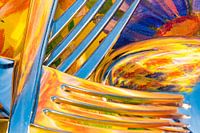 Fork and spoon against a colourful background