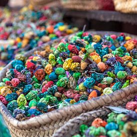 Colorful dried flowers and herbs for sale in a souk (market) in Marrakech, Morocco by WorldWidePhotoWeb