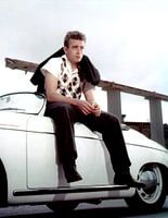 James Dean sitting on a Porsche Speedster