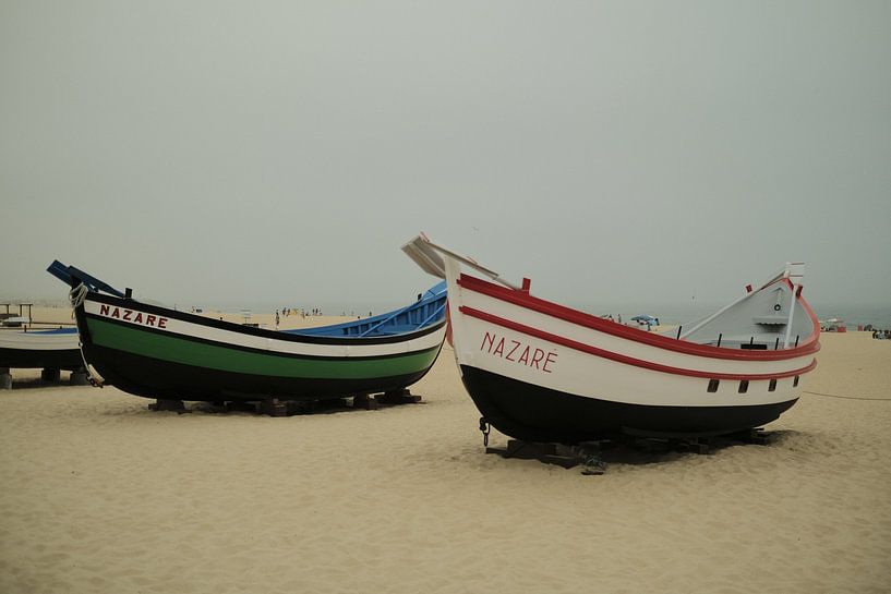 Boats on the beach in Nazaré by S. Romijn