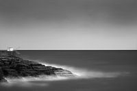 Fishing hut on rocks