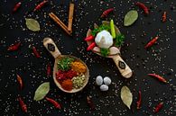 Spices and herbs on wooden spoons by Francis Dost thumbnail