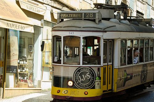 Old tram through the streets of Lisbon