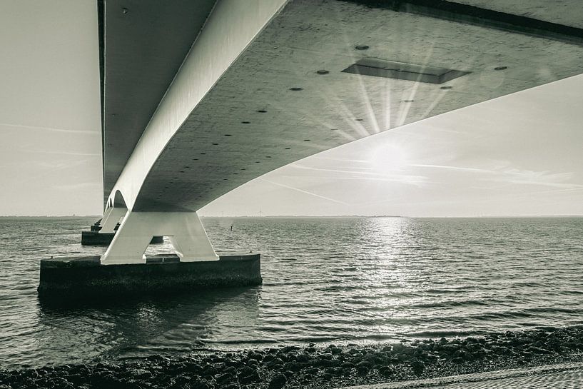Detail of Zeeland bridge with radiant sunlight by Fotografiecor .nl