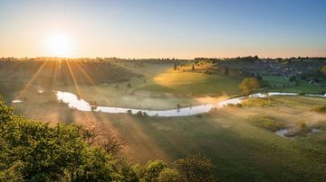 Panorama picture of fog at sunrise in the Eselsburg valley with river Brenz near Heidenheim
