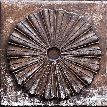Round carvings on a door in Labeaume in France by Cindy Mulder