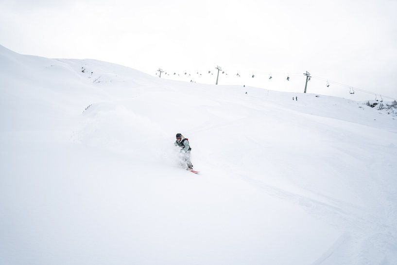 Freeriding powder snow riding in Montafon, Vorarlberg Snowboard group by Leo Schindzielorz