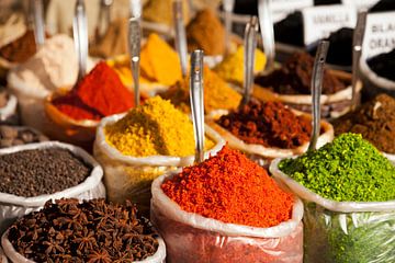 Spices on the market of Goa, India by Peter Schickert