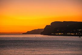 Sunset on the Sesimbra coast near Lisbon by Leo Schindzielorz