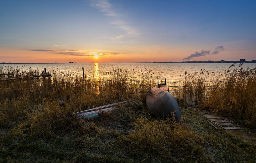 Boats with winter frost at sunrise in Durgerdam by peterheinspictures