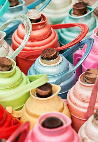 Multi-colored arrangement of thermos bottles with cork caps