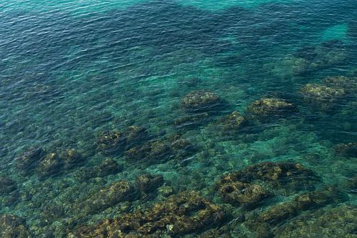 Turquoise blue water in a rocky cove 1