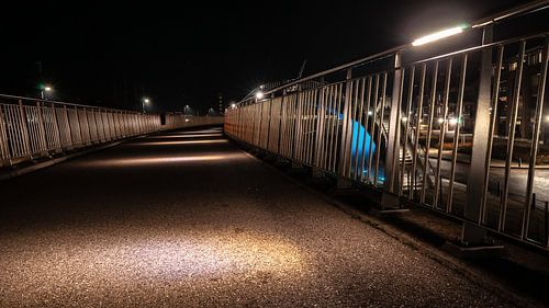 Concrete walkway with LED illuminated atmosphere lamps and aluminum fencing