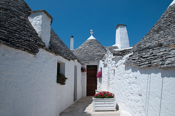 white trulli in Alberobello, Italy