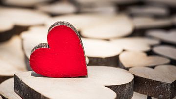 Red wooden love heart background by Alex Winter
