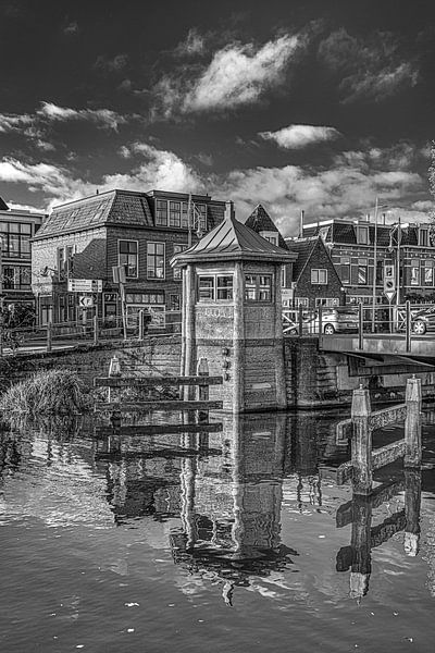 Historic bridge keeper's house on Leeuwarden canal by Harrie Muis