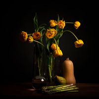 Still life yellow tulips and lens ball