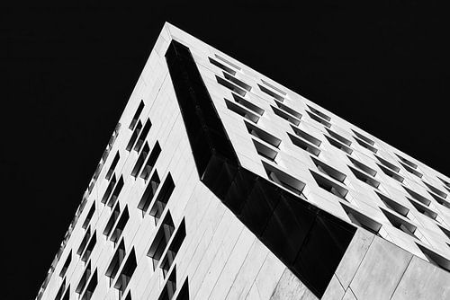 Hourglass office building in contrasting black and white