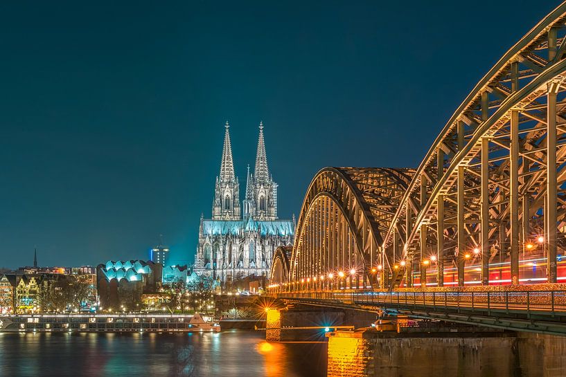COLOGNE CATHEDRAL WITH HOHENZOLLERN BRIDGE AT NIGHT by Christian Schmidt