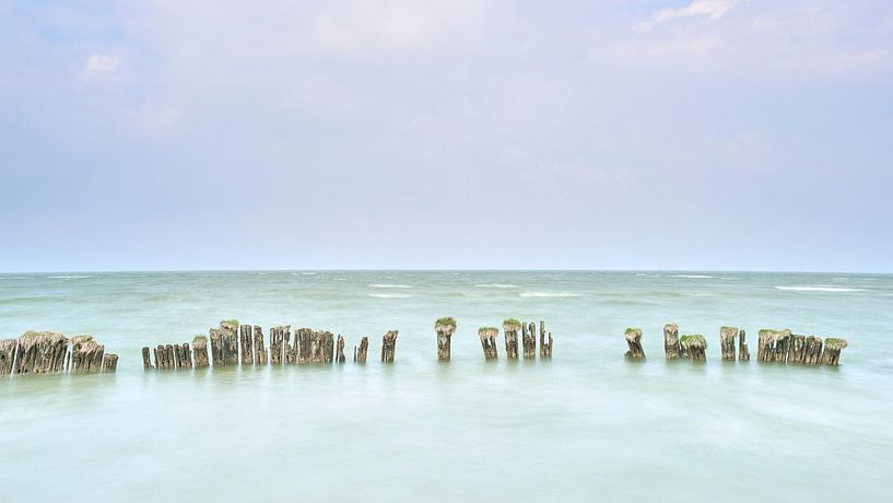 Old wooden breakwater off the coast of Hindeloopen by Jenco van Zalk