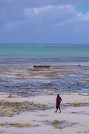 A maasai man poses at the beach at Jambiani
