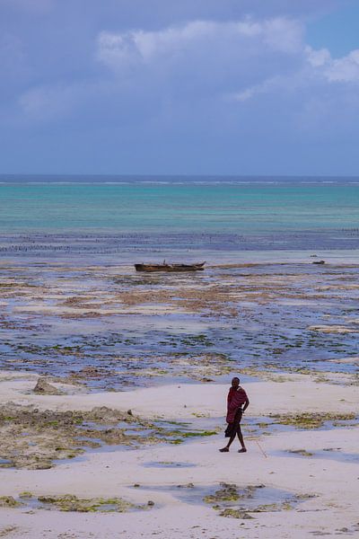 A maasai man poses at the beach at Jambiani by Lisette van Leeuwen