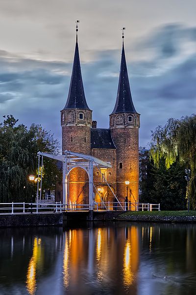 Delft's East Gate shrouded in evening light. by Robert Jan Smit