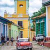 Red oldtimer in colourful Trinidad, Cuba by Jessica Lokker