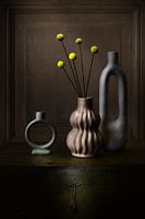 Modern still life of vases with yellow drumsticks