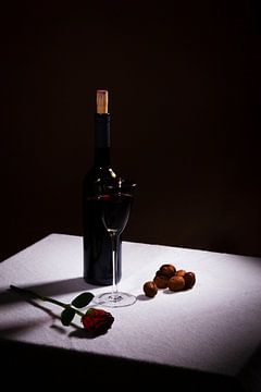 Still life with red wine and red rose by Rudy Rosman