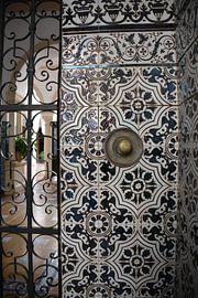 Interior porch with doorbell and black and white tiles in Andalusia by My Footprints
