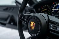 Logo Porsche on the steering wheel of a Porsche 911 by Bas Fransen thumbnail