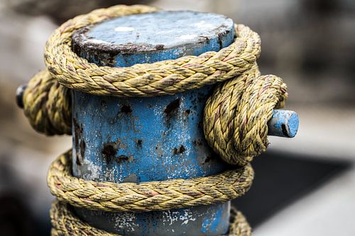 Ship's rope around a mooring post by Rik Verslype